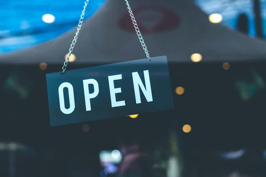 open sign hanging in business window